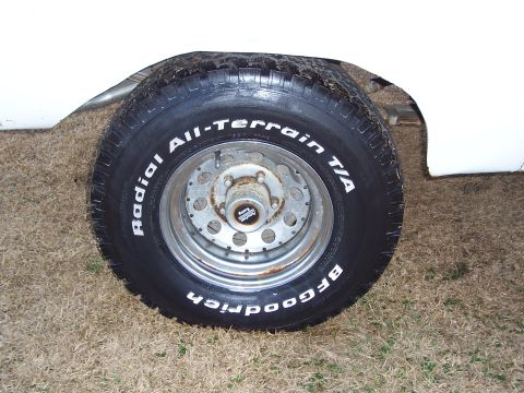 1974 Ford Bronco - Close-up of a white vehicle's wheel and BFGoodrich Radial All-Terrain T/A tire.