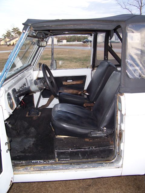 1974 Ford Bronco - Interior view of a 1974 Ford Bronco, highlighting the seats and dashboard.