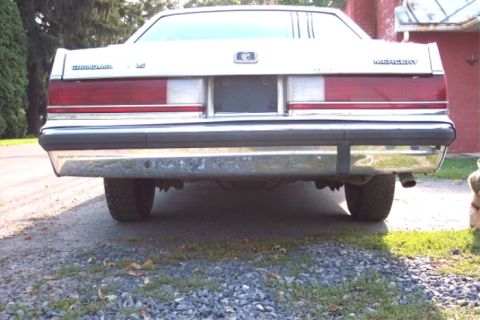 1988 Mercury Grand Marquis - The rear of a 1988 Mercury Grand Marquis, showing its distinctive taillight design and chrome bumper.