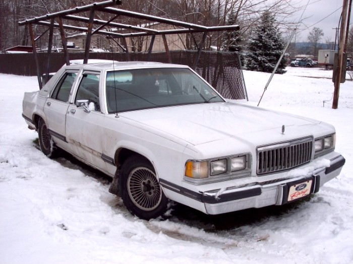 White 1988 Mercury Grand Marquis in snow, 3q-front view