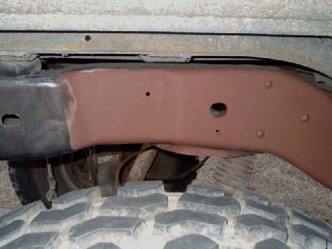 1984 Ford Bronco - rear frame, sanded and primer being applied