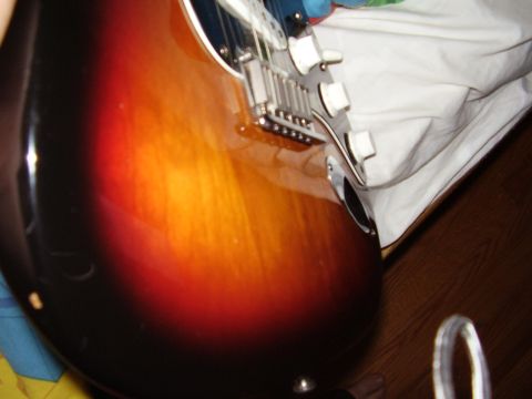 1996 Ford F-150 - Close-up of an electric guitar's sunburst body and hardware.