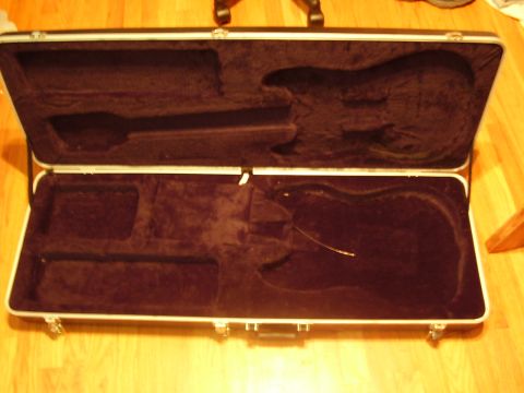 1996 Ford F-150 - Empty guitar case with molded interior for a guitar and accessories.