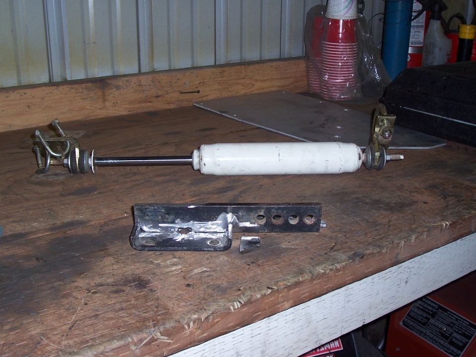 shock absorber and bracket on workbench