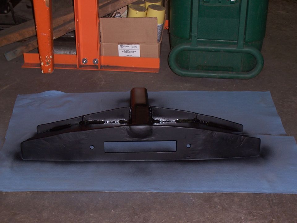 Custom fabricated bumper with a rectangular cutout for a winch