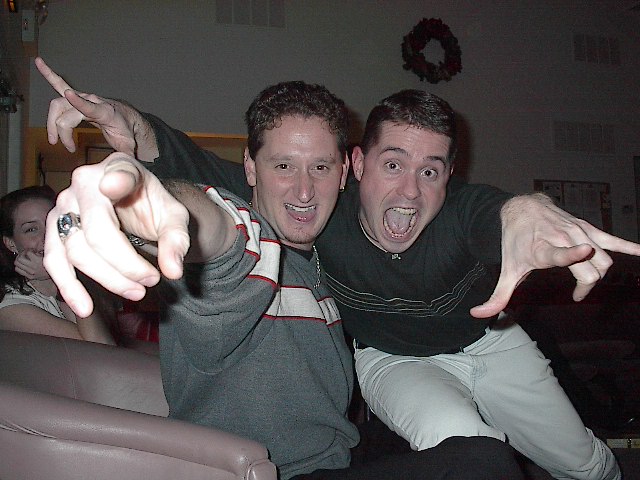Two men making exaggerated poses and faces