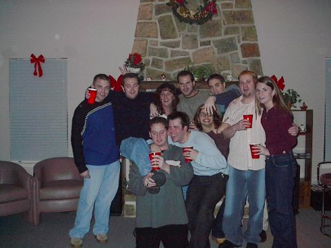 1987 Suzuki Samurai - Friends gather for a holiday celebration, holding red cups and posing for a photo.