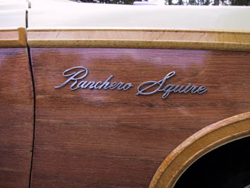 1970 Ford Ranchero - Close-up of the 'Ranchero Squire' emblem on a vehicle with wood paneling.