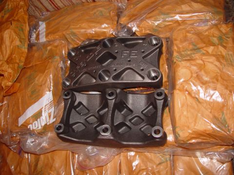 1969 Ford Fairlane - A pair of engine mounts, one marked with 'FE' and 'IRONWORKS', are displayed on top of bagged goods.