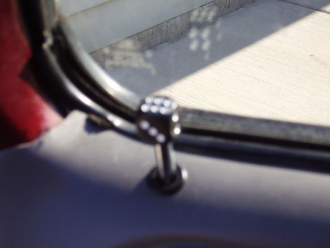 1996 Ford F-150 - Close-up of a dice-shaped accessory mounted on a metal bar, likely an interior car accessory.