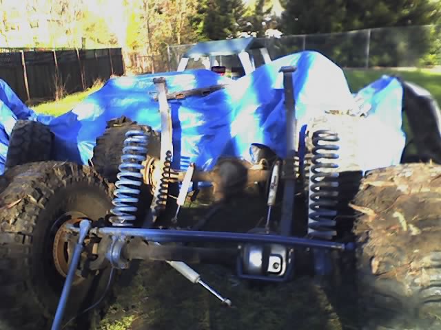Front axle and coil-spring suspension of a truck during teardown with big mud tires
