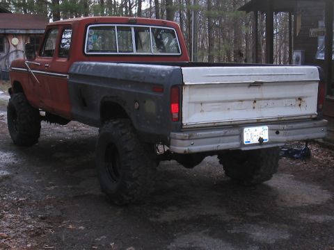 1979 Ford Bronco - This pickup truck has a two-tone paint scheme and appears to be from the late 1970s.