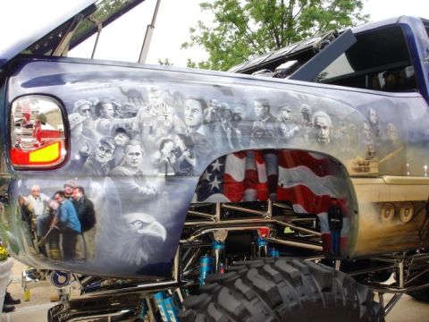 1966 Land Rover Discovery - This customized pickup truck features extensive airbrushed artwork depicting historical figures and patriotic symbols.