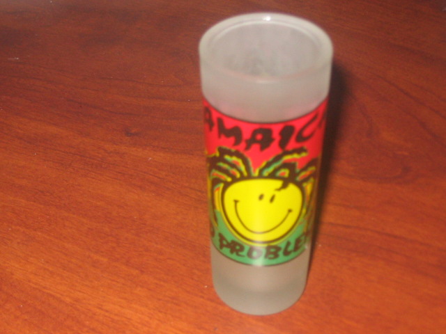shot glass with "Jamaica" and "No Problem" text and a smiley face with dreadlocks
