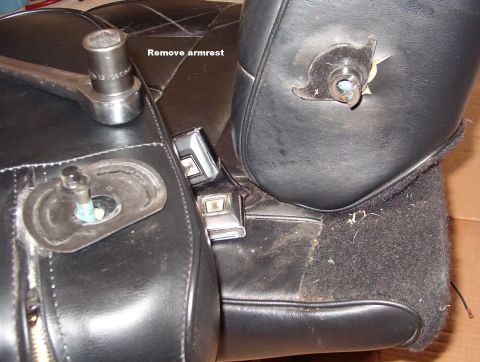 1994 Ford Crown Victoria - Armrest Removed If you need to remove the upholstery from the armrest, remove the plastic bushing & shield, and finish unzipping it.