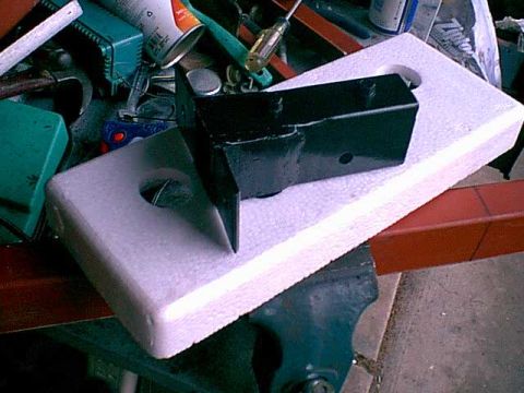 1983 Ford Bronco - i used a bolt in spacer. this way i can adjust the presure on the flap to stop the rattling. i just drilled and tapped the holes.