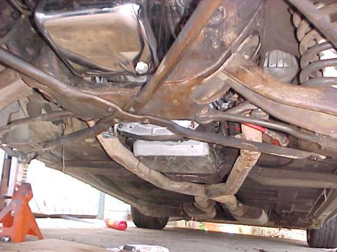 1973 Ford Ranchero - The underside of a vehicle is captured, revealing its mechanical components and suspension system.