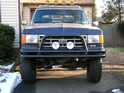 1991 Ford Bronco - This 1991 Ford Bronco features a prominent bull bar and aggressive off-road tires, suggesting it's ready for adventure.