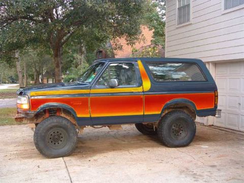 1993 Ford Bronco - This 1993 Ford Bronco features a distinctive blue and orange two-tone paint scheme.