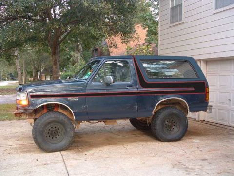 1993 Ford Bronco - This 1993 Ford Bronco is seen from the side, parked in a driveway.
