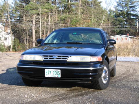 1991 Ford Crown Victoria LTD - Front view of a black 1991 Ford Crown Victoria LTD.