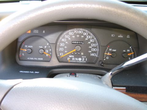 1991 Ford LTD Crown Victoria - Interior view of a 1991 Ford Crown Victoria LTD dashboard, displaying the odometer reading of 69,115 miles.