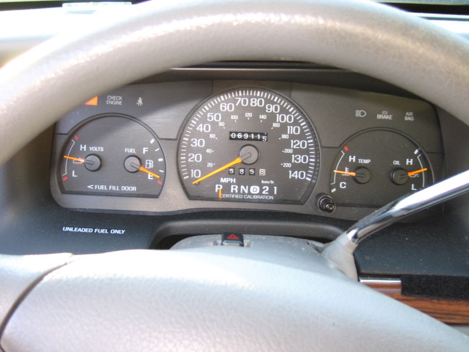 1991 Ford Crown Victoria LTD dashboard with odometer showing 69115 miles