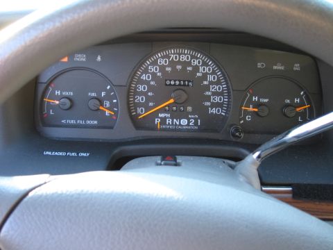 1991 Ford LTD Crown Victoria - Dashboard gauges including speedometer, fuel, volts, temperature, and oil levels.