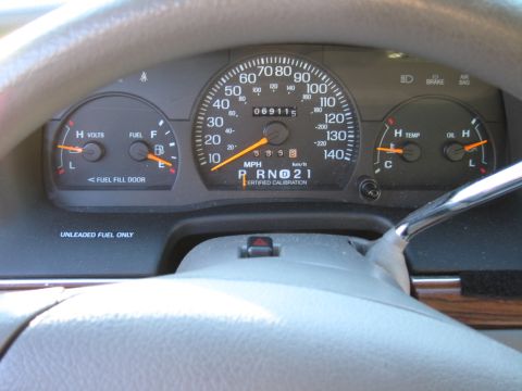 1991 Ford LTD Crown Victoria - The vehicle's interior dashboard displays various gauges, including the speedometer and odometer.