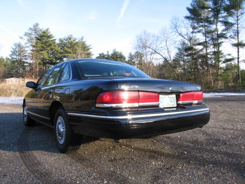 1991 Ford LTD Crown Victoria - Rear view of a 1991 Ford Crown Victoria LTD, showing its distinctive taillights and chrome trim.
