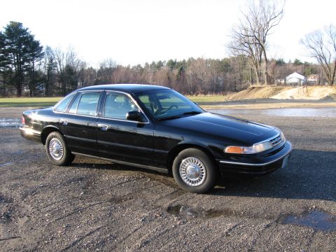 1991 Ford LTD Crown Victoria - 1991 Ford Crown Victoria LTD parked on a gravel lot under a clear sky.