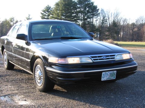 1991 Ford LTD Crown Victoria - This black sedan's grille and headlight design suggest a 1992 model year, not 1991.