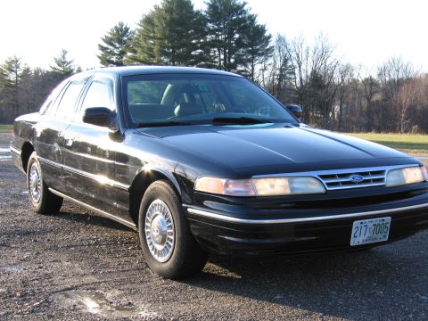 1991 Ford LTD Crown Victoria - This 1991 Ford Crown Victoria LTD is captured in a 3q-front view, its classic sedan body style.