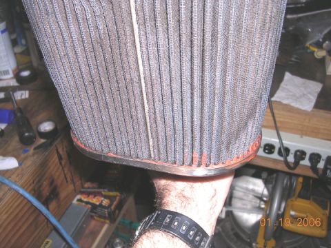 1994 Ford Bronco - A dirty air filter is shown in a workshop setting, with a date stamp indicating it was photographed in 2006.