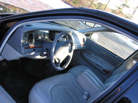 1991 Ford LTD Crown Victoria - Interior view of a 1991 Ford Crown Victoria LTD, highlighting the dashboard and seating.