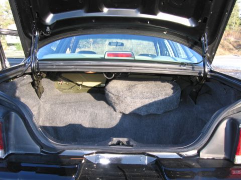 1991 Ford LTD Crown Victoria - The spacious trunk of a 1991 Ford Crown Victoria LTD is shown with the spare tire in place.