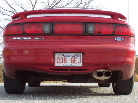 1996 Ford Probe - The rear of a red 1996 Ford Probe GT is shown, dual exhaust pipes and a spoiler.