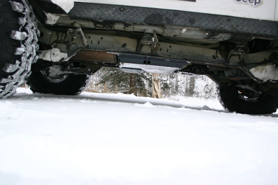 2003 Jeep TJ undercarriage with snow on the ground