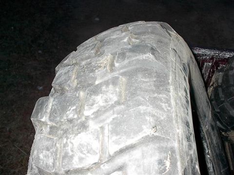 2001 Dodge 1500 - A close-up view of a white vinyl truck bed cover, showing its texture and condition.