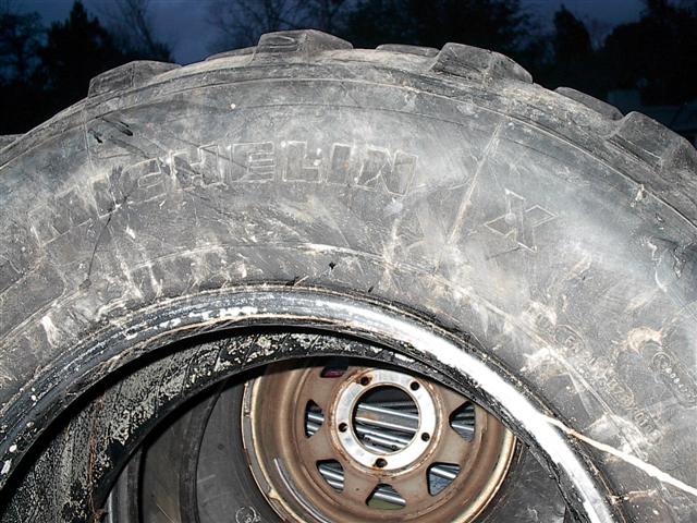 Close-up of a tire and wheel assembly, possibly from a truck
