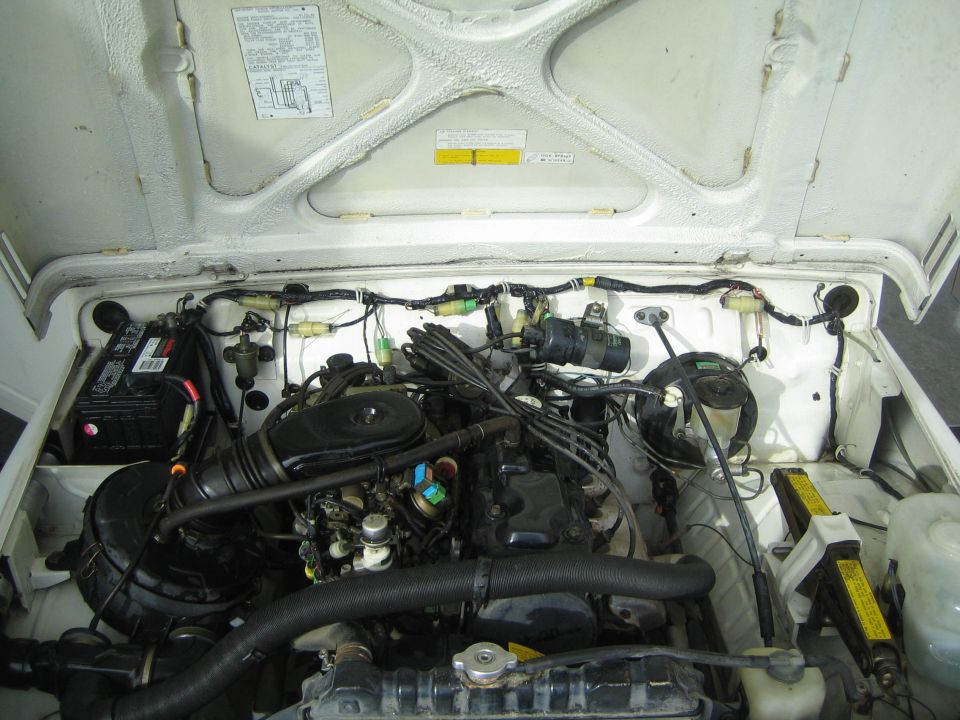 Engine bay of a 1987 Suzuki Samurai