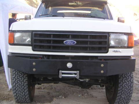 1988 Ford Bronco - Front view of a white 1987 Ford Bronco, an aftermarket bumper and winch.