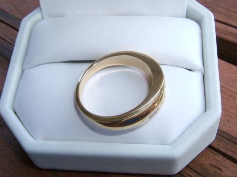 1990 Ford Bronco - A gold ring with small diamonds is displayed in a white jewelry box.