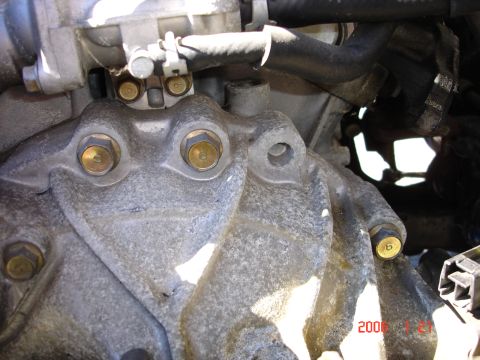 1993 Mazda MX-3 - Close-up view of engine block and transmission housing components, with a date stamp indicating 2006.