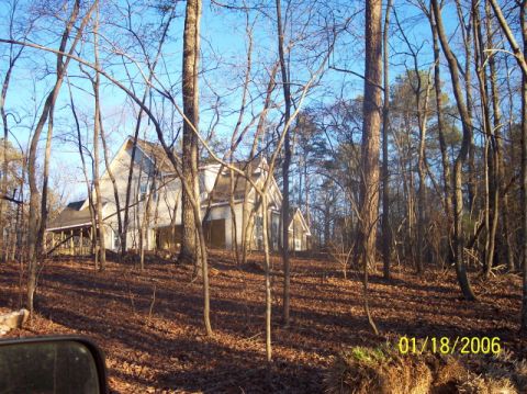 1987 Toyota 4Runner - A house is visible through trees on a sunny day with a date stamp of 01/18/2006.