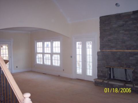 1987 Toyota 4Runner - Interior of a room with a stone fireplace and French doors, dated 01/18/2006.