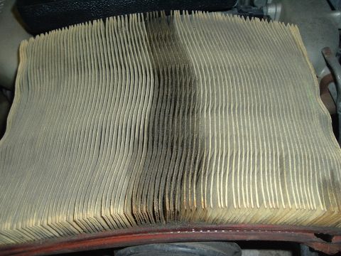 1993 Ford Taurus - A heavily soiled air filter shows significant discoloration from use.
