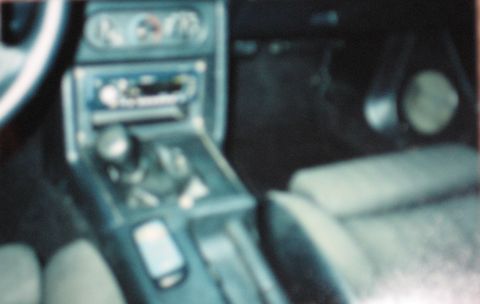 1990 Ford Mustang - Interior view of a 1990 Ford Mustang, showing the center console and dashboard details.