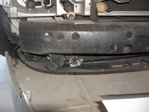 1998 Ford Taurus - Close-up of the front end of a 1998 Ford Taurus, showing the bumper and surrounding components.