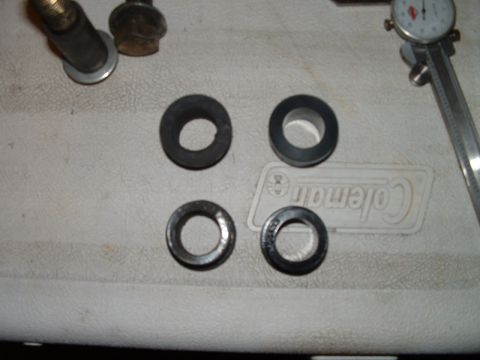 1995 Ford Bronco - A caliper rests next to four washers, suggesting a measurement or repair context.